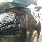 Before and after photographs of a damaged, black, Range Rover that was repaired by Elite Paint & Body Shop in West Palm Beach, FL.